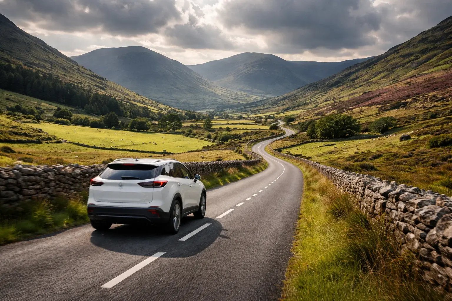 Electric vehicle driving through scenic Irish countryside demonstrating rural EV viability